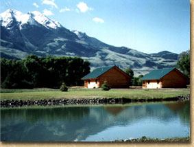 Our cabins and fishing pond with views of Emigrant Mt.
